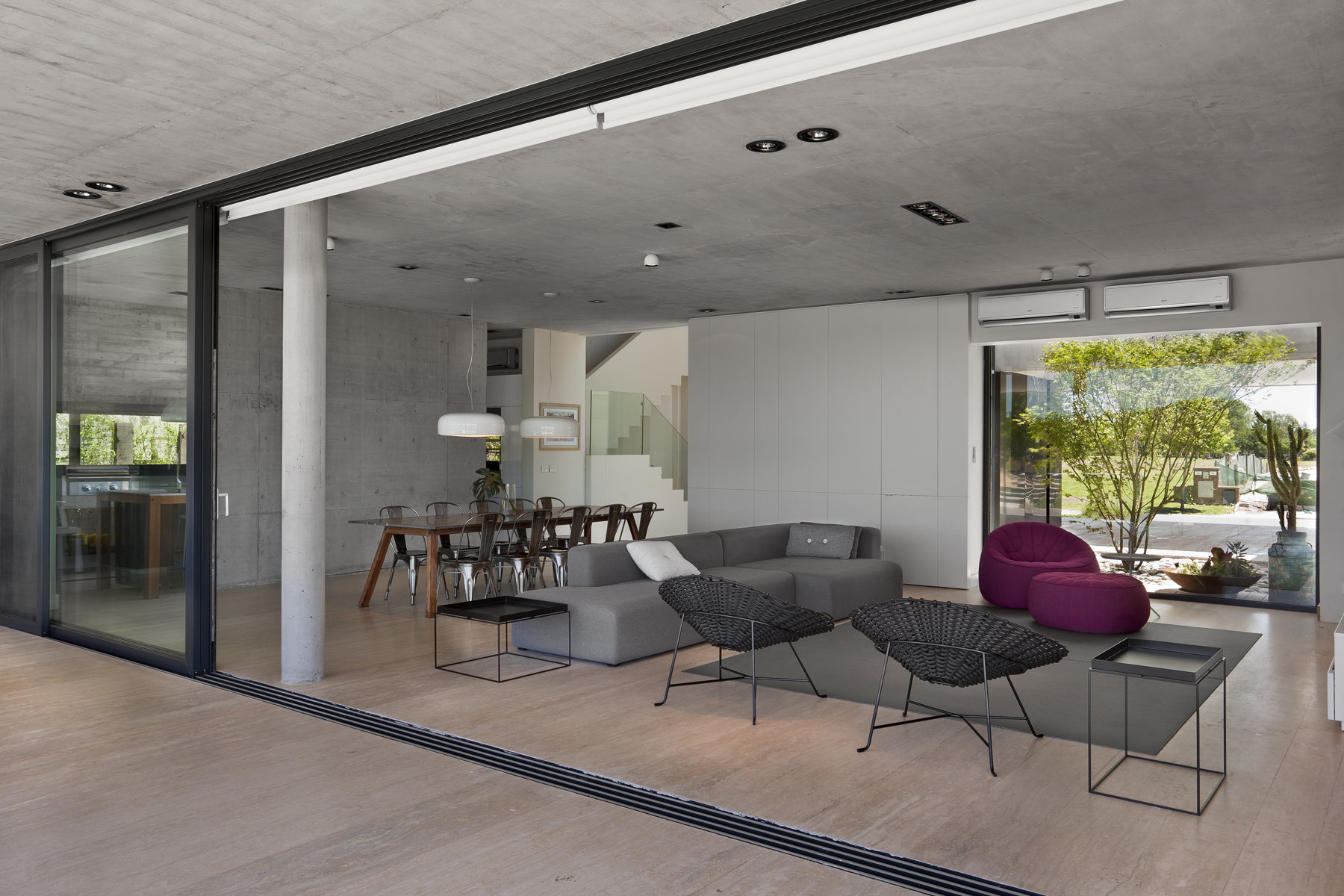 a room with a table chairs and a couch