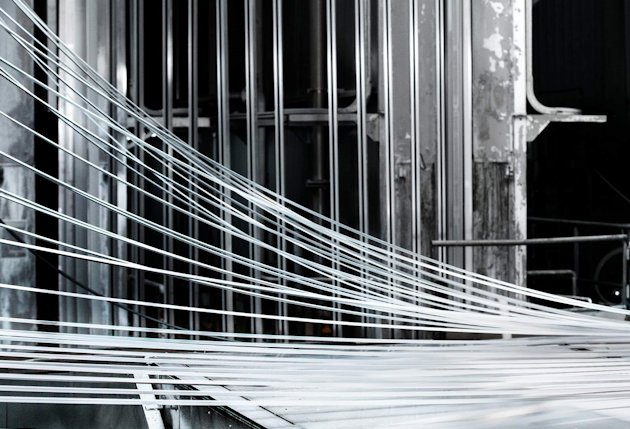 Lengths of aluminum emerging from a paint line