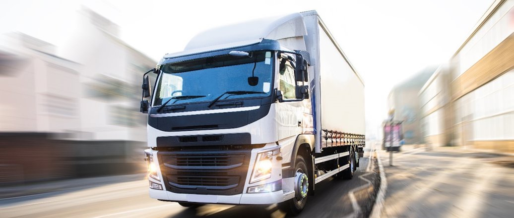 Large commercial trailer vehicle on road
