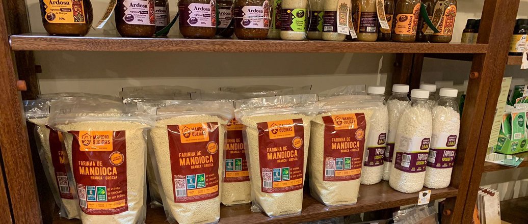 a shelf with many jars of food on it