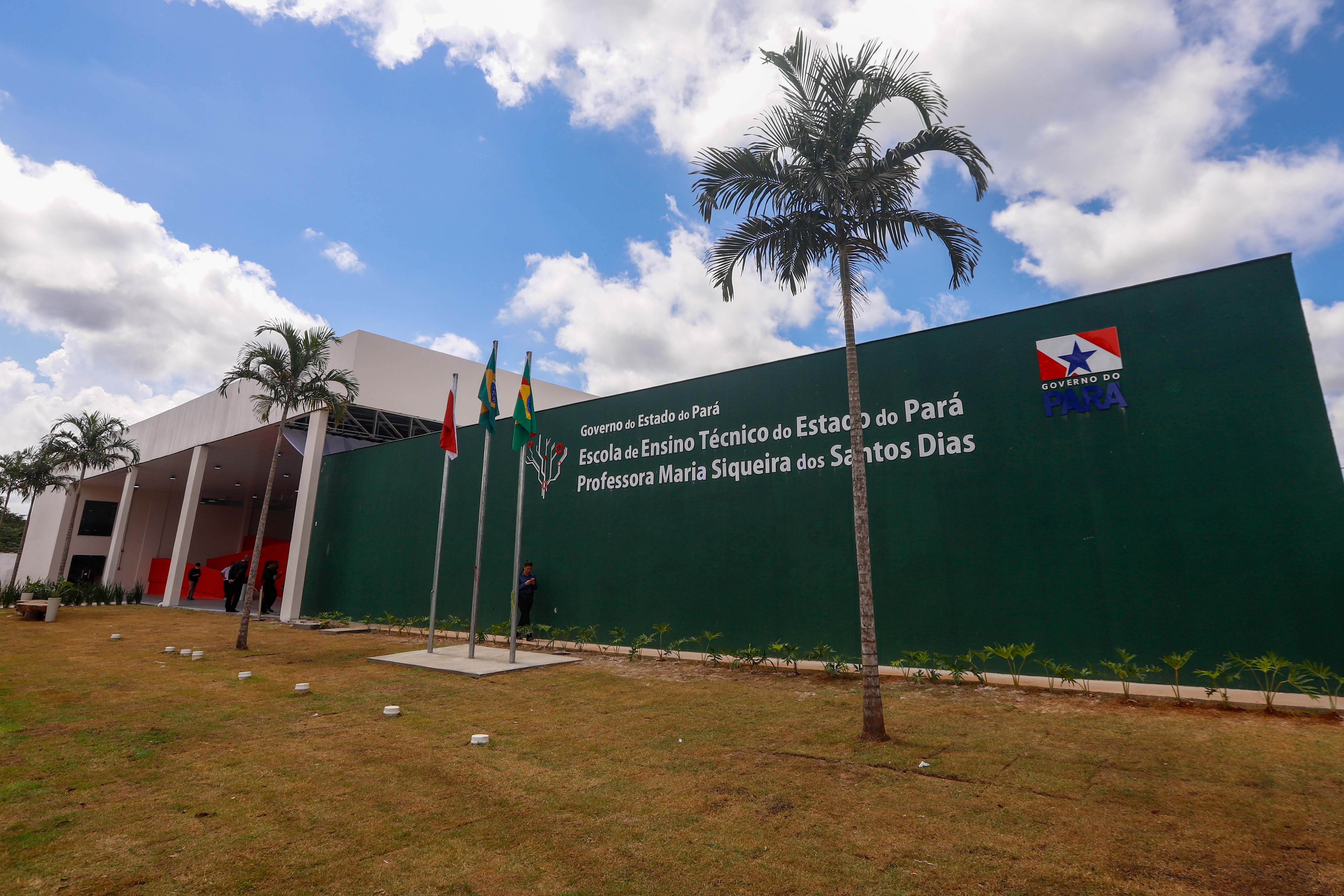 a green building with flags