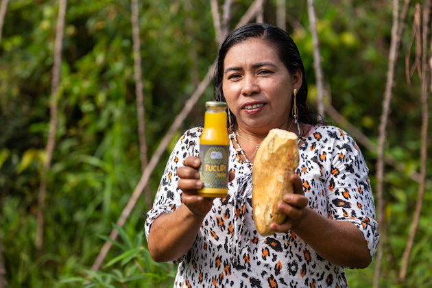a person holding a bottle of alcohol