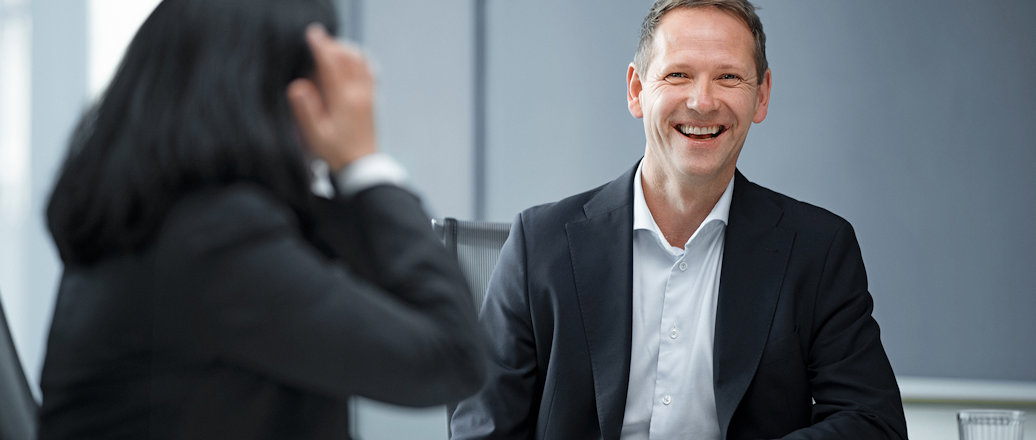 a man and a woman smiling