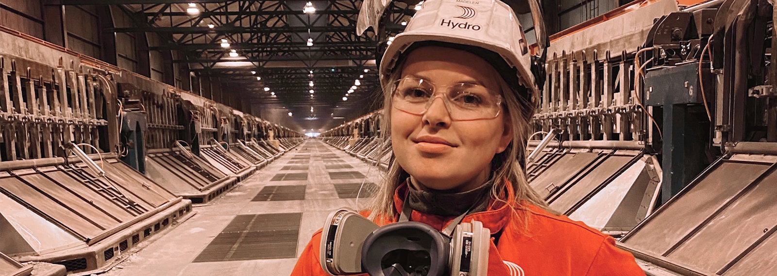 a person wearing a helmet and headphones in a warehouse