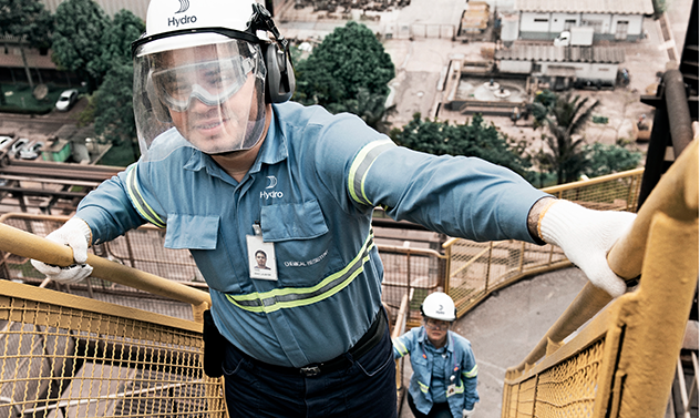 a man wearing a helmet and holding a stick