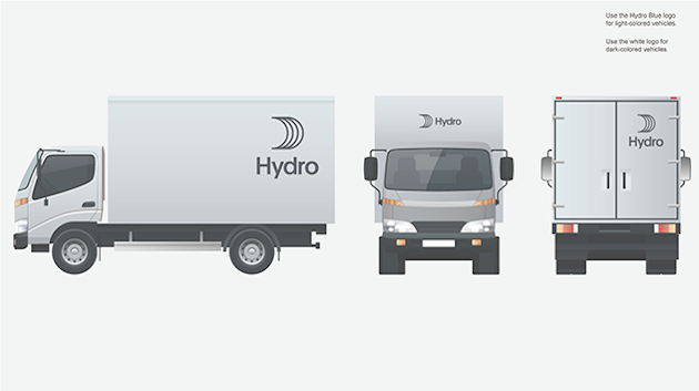 small van with large logo on back top, front and center above cab, top right back door