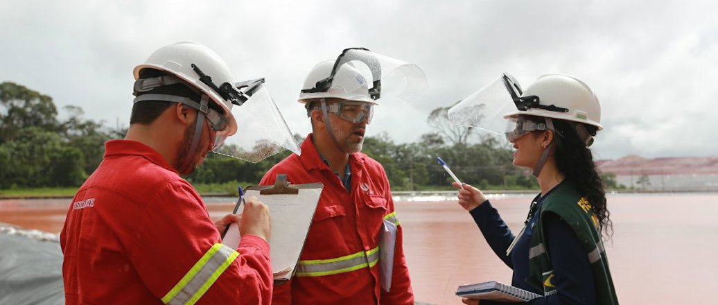 two men and a woman at residue deposit