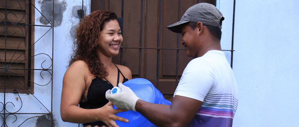 a man and woman holding a baby