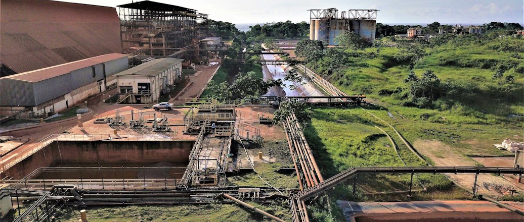 a train track with a building in the background