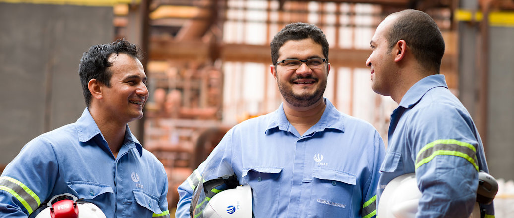 a group of men in blue shirts