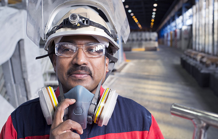 male worker in protective gear on factor floor