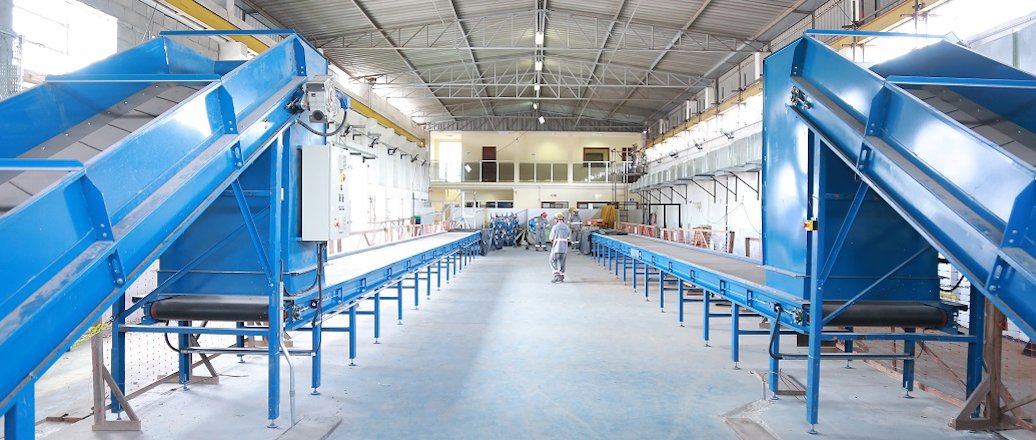 a large room with blue and white machinery
