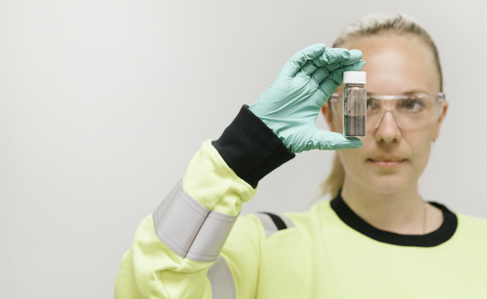 Woman holding a glass of graphite