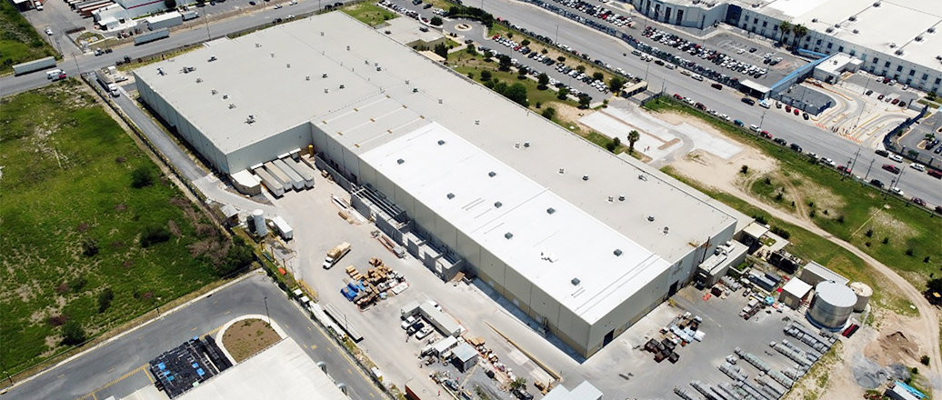 a large building with a parking lot