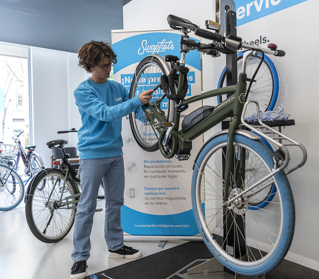 a person standing next to a bicycle