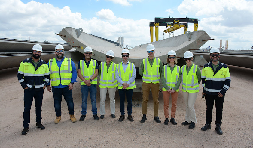 a group of people wearing safety vests