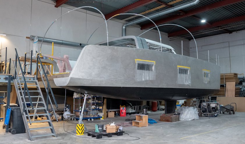 a large metal structure with ladders and boxes in a warehouse