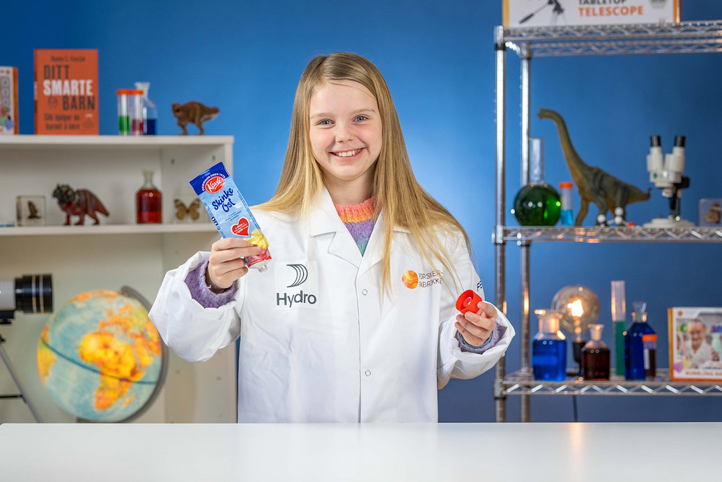 a girl holding an aluminium tube