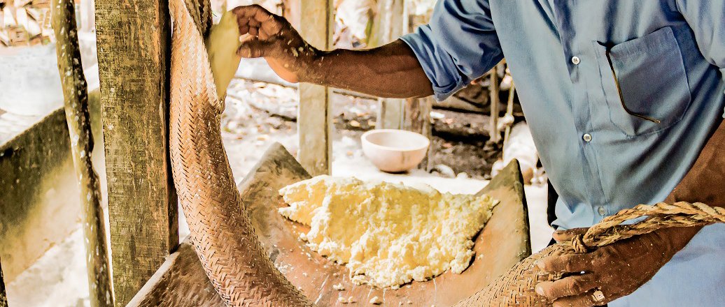 a man holding a large snake