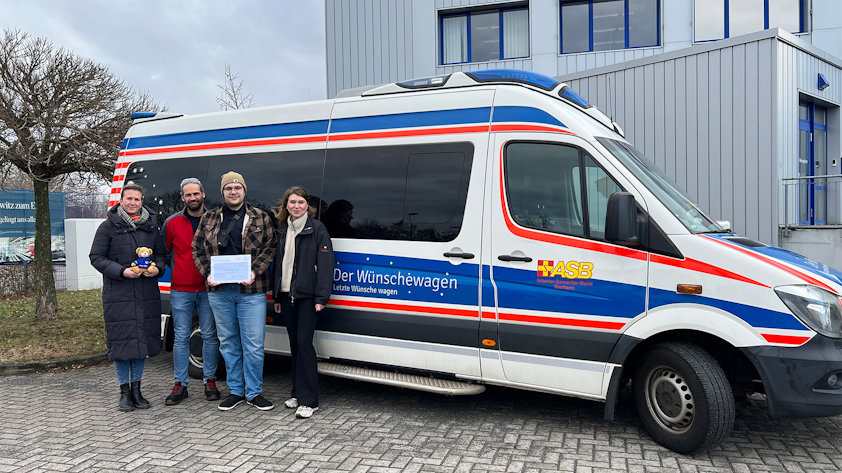 a group of people standing next to a van