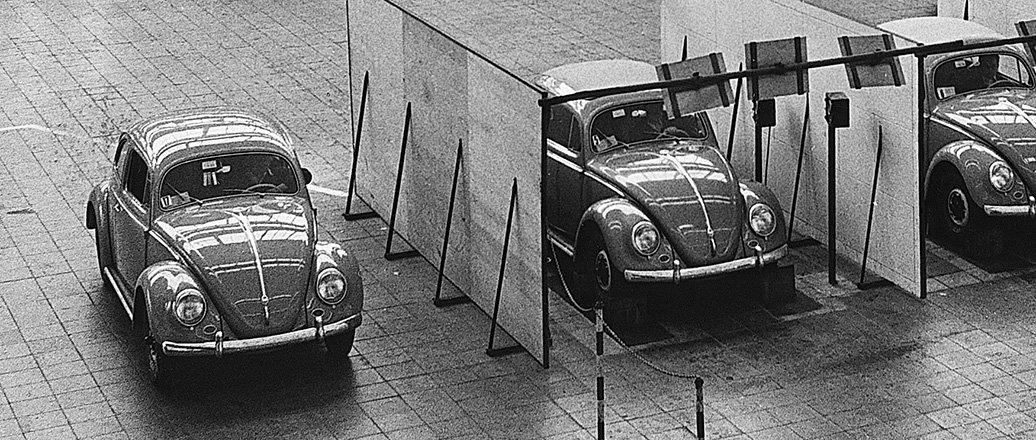 Three VW Beetles in an exhibition