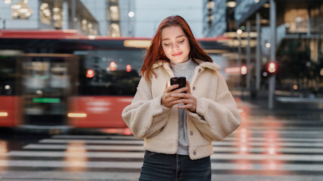 a woman holding a phone