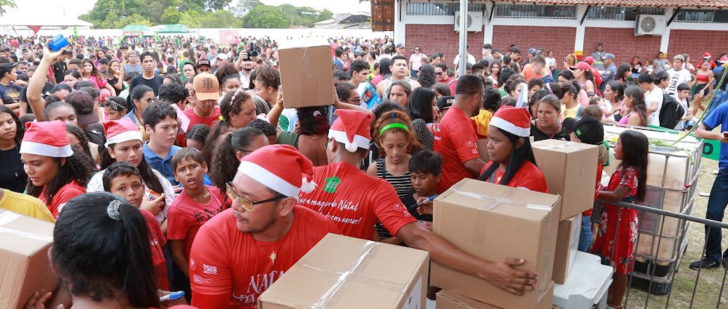 a group of people wearing red shirts and hats