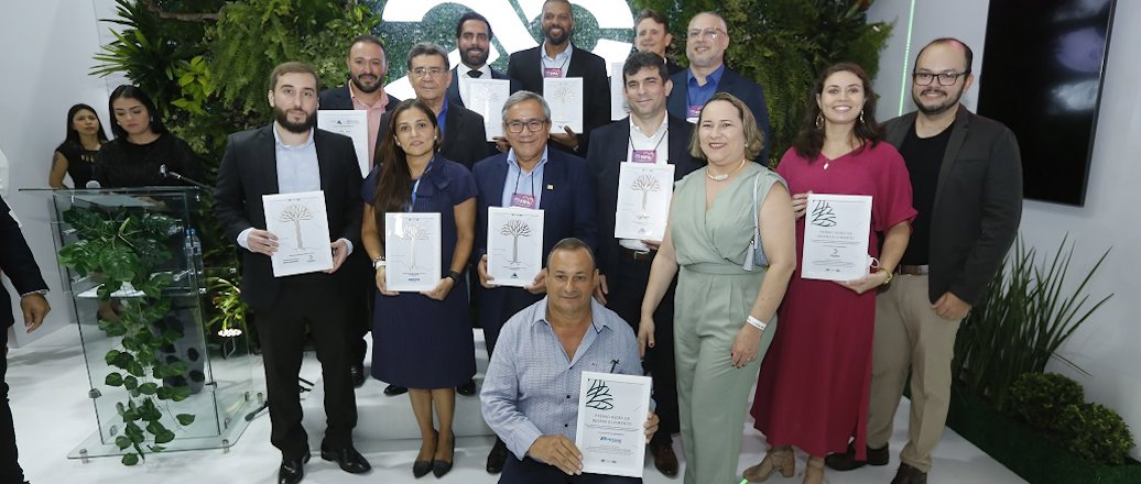 a group of people holding certificates