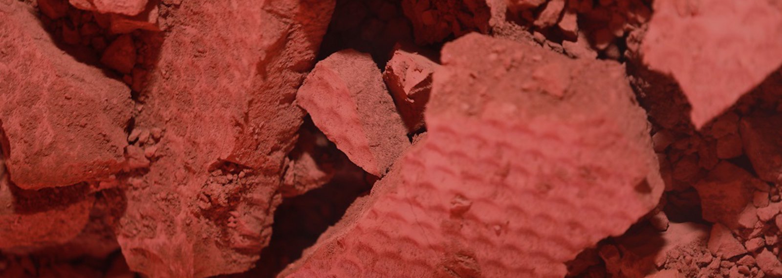 a close up of some red rocks