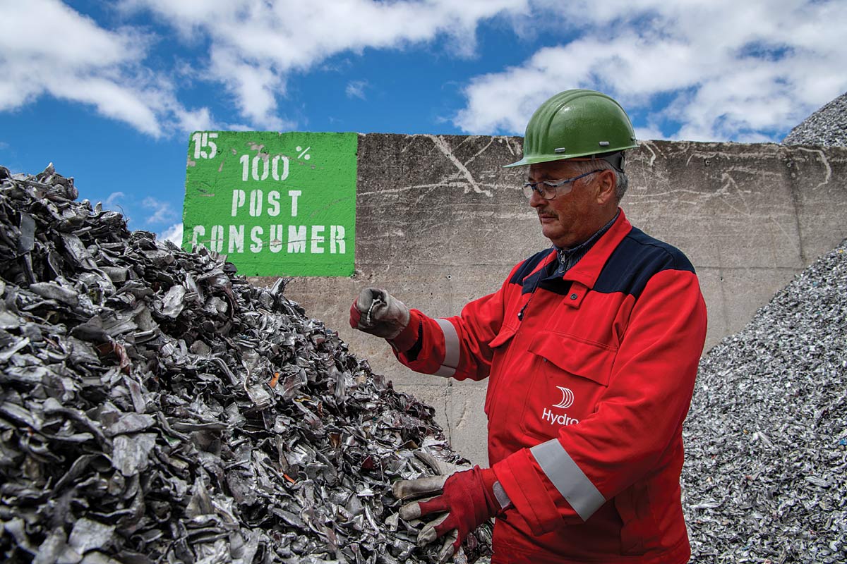 Hydro employee handling post-consumer scrap at the recycler in Clervaux, Luxembourg