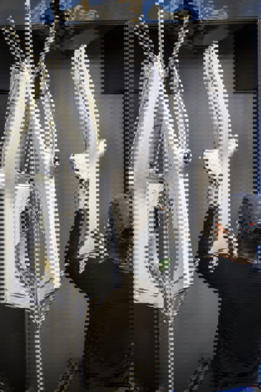 a person holding a large piece of machinery